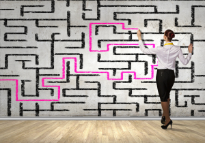 businesswoman solving maze problem