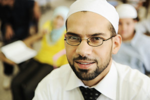 muslim arabic children with teacher at school